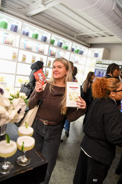 A guest captured with a Kit Kat bar and the Housemaidthemed popcorn.